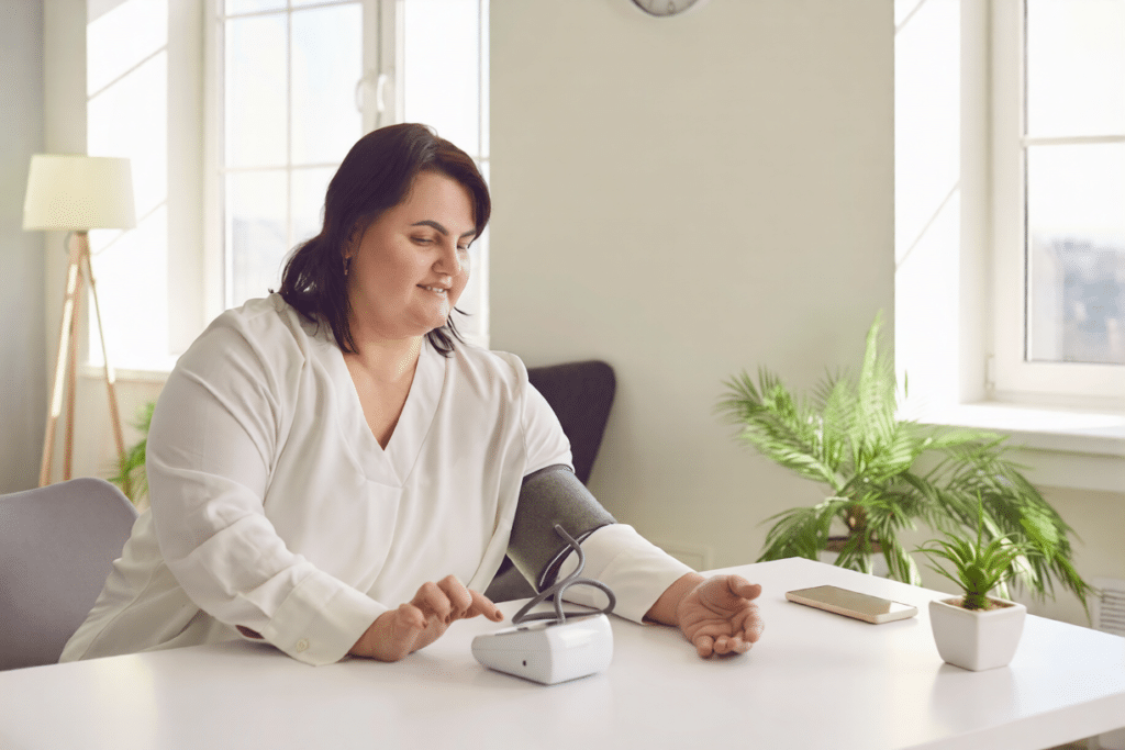 A woman checks her blood pressure every day to see if medical weight loss is right for her.