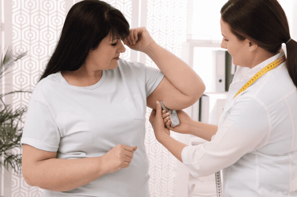 A woman maintains regular weight loss check-ins with her clinician.