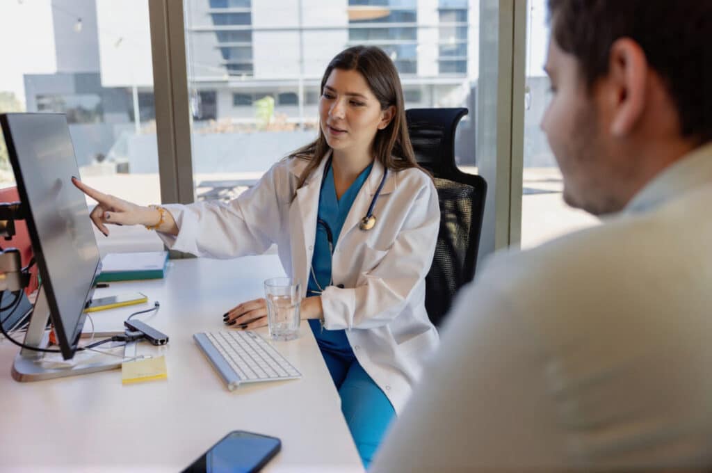 A clinician is discussing weight loss with a man.