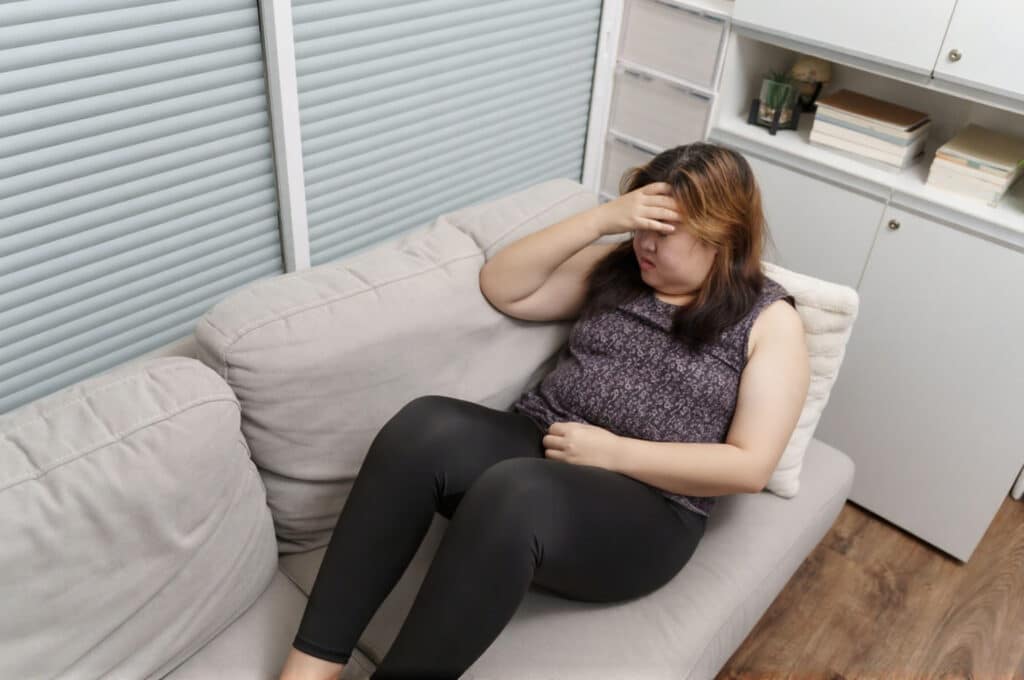 A woman experiences a mild headache when starting medical weight loss.